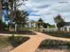 A community entrance features a walkway under a arbor and beautiful landscaping at 384 Bly St, Rock Hill, SC 29732