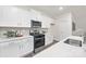 Modern kitchen with stainless steel oven and microwave and white cabinets at 384 Bly St, Rock Hill, SC 29732