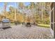 Brick paved patio with firepit, grill, and seating area at 4008 Pinot Way, Indian Land, SC 29707