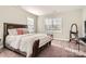 Spacious bedroom with hardwood floors and a large window at 4008 Pinot Way, Indian Land, SC 29707