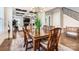 Bright dining room with hardwood floors, chandelier and view of living room at 4008 Pinot Way, Indian Land, SC 29707