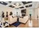 Spacious living room features hardwood floors, a fireplace, and coffered ceiling at 4008 Pinot Way, Indian Land, SC 29707