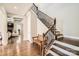 Elegant staircase with wrought iron railing and wooden steps at 4008 Pinot Way, Indian Land, SC 29707