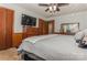 Spacious bedroom with a king-size bed, dresser, and ceiling fan at 511 E Church St, Kershaw, SC 29067