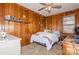 Cozy bedroom with a full-size bed and wood paneled walls at 511 E Church St, Kershaw, SC 29067