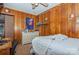 Bright bedroom featuring wood paneling and ample storage at 511 E Church St, Kershaw, SC 29067