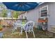 Wooden deck with patio table, chairs, and umbrella at 511 E Church St, Kershaw, SC 29067