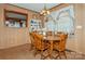 Bright dining room features a round table with wooden chairs, and built-in hutch at 511 E Church St, Kershaw, SC 29067