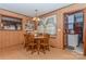 Bright dining room features a round table with wooden chairs, and built-in hutch at 511 E Church St, Kershaw, SC 29067