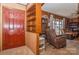 Home entryway with red door and built-in shelving at 511 E Church St, Kershaw, SC 29067