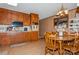 Kitchen with wood cabinets, dining area, and a built-in microwave at 511 E Church St, Kershaw, SC 29067