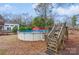 Above ground pool with wooden deck and gate access at 511 E Church St, Kershaw, SC 29067