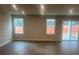 Spacious living area with hardwood floors and access to a back patio at 605 Nesbe St # 2228, Lancaster, SC 29720