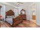 Spacious bedroom with wood furniture and hardwood floors at 9023 Daring Ct, Charlotte, NC 28215