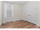 Well-lit bedroom with hardwood floors and double door closet at 9023 Daring Ct, Charlotte, NC 28215