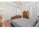 Well-lit bedroom with wood bed frame and hardwood floors at 9023 Daring Ct, Charlotte, NC 28215