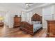 Bright bedroom featuring a large bed and hardwood floors at 9023 Daring Ct, Charlotte, NC 28215