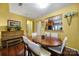 Dining area with hardwood floors, oval table, and kitchen views at 9450 Shumacher Nw Ave, Concord, NC 28027