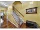 Spacious entryway with hardwood floors and a staircase leading upstairs at 9450 Shumacher Nw Ave, Concord, NC 28027