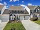 Two-story home with a two-car garage and well-maintained landscaping at 9450 Shumacher Nw Ave, Concord, NC 28027