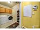 Laundry room with washer, dryer, and shoe storage at 9450 Shumacher Nw Ave, Concord, NC 28027