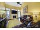 Living room with hardwood floors, fireplace, and leather couches at 9450 Shumacher Nw Ave, Concord, NC 28027