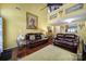 Living room with hardwood floors, fireplace, and leather couches at 9450 Shumacher Nw Ave, Concord, NC 28027