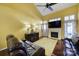 Living room with hardwood floors, fireplace, and leather couches at 9450 Shumacher Nw Ave, Concord, NC 28027