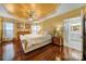 Spacious main bedroom with hardwood floors and en-suite bathroom at 9450 Shumacher Nw Ave, Concord, NC 28027