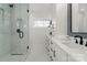 Modern bathroom with a large walk-in shower and double vanity at 104 Isle Of Pines Rd, Mooresville, NC 28117