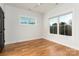 Bright bedroom with hardwood floors and large windows at 104 Isle Of Pines Rd, Mooresville, NC 28117