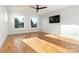 Bright bedroom with hardwood floors and large windows at 104 Isle Of Pines Rd, Mooresville, NC 28117