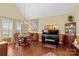 Dining area with hardwood floors, chandelier, and adjacent to a piano at 105 Whimbrel Ln, Mooresville, NC 28117