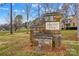Stone community entrance sign reading 'Harbor View' against a backdrop of trees and homes at 105 Whimbrel Ln, Mooresville, NC 28117
