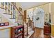 Welcoming foyer with hardwood floors, staircase, and natural light from the front door at 105 Whimbrel Ln, Mooresville, NC 28117