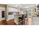 Kitchen with white cabinets, a breakfast bar, and stainless steel appliances at 105 Whimbrel Ln, Mooresville, NC 28117