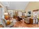 Bright living room with hardwood floors, fireplace, and staircase views at 105 Whimbrel Ln, Mooresville, NC 28117