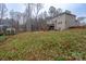 Spacious backyard with two-story home and wooded backdrop at 123 Kingfisher Dr, Mooresville, NC 28117