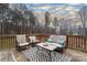 Relaxing deck with wooded views, seating area, and a view of the sunset at 123 Kingfisher Dr, Mooresville, NC 28117