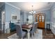 Bright dining room features a rustic wooden table and gray chairs at 123 Kingfisher Dr, Mooresville, NC 28117