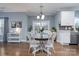 Kitchen features a round dining table and white chairs near sliding doors at 123 Kingfisher Dr, Mooresville, NC 28117