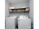 Clean laundry room, washer, dryer, and shelving at 123 Kingfisher Dr, Mooresville, NC 28117