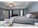 Spacious main bedroom with king bed and ceiling fan at 123 Kingfisher Dr, Mooresville, NC 28117