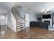 Staircase with white railing and a view into the living room at 123 Kingfisher Dr, Mooresville, NC 28117