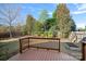 Deck overlooks a fenced backyard with raised garden beds at 13917 Sugar Oats Ln, Charlotte, NC 28213