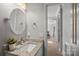 Bathroom with granite vanity and view into hallway at 13917 Sugar Oats Ln, Charlotte, NC 28213