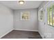 Small laundry room with tile flooring and exterior access at 13917 Sugar Oats Ln, Charlotte, NC 28213