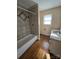 Bathroom with tub, shower, and double vanity at 1426 Reid Harkey Rd, Matthews, NC 28105