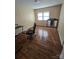 Bedroom with hardwood floors and a large mirror at 1426 Reid Harkey Rd, Matthews, NC 28105