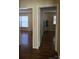 Bright hallway with hardwood floors and access to other rooms at 1426 Reid Harkey Rd, Matthews, NC 28105